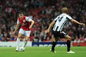 Arsenal's Carl Jenkinson Faces Off Against Udinese's Joel Ekstrand in 2011-12 UEFA Champions League Play-Off