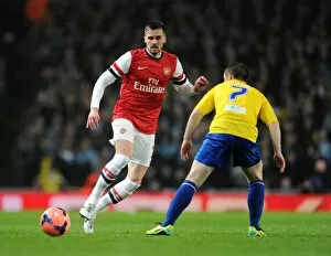 Images Dated 24th January 2014: Arsenal's Carl Jenkinson Fends Off Coventry's John Fleck in FA Cup Clash