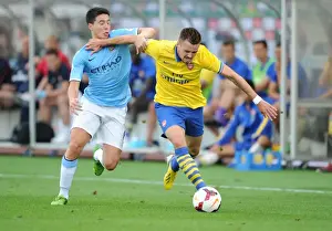 Arsenal V Manchester City Pre Season 2013-14 Prints: Arsenal's Carl Jenkinson Fends Off Manchester City's Samir Nasri in Pre-Season Clash