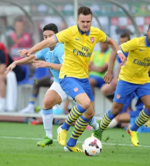 Arsenal V Manchester City Pre Season 2013-14 Prints: Arsenal's Carl Jenkinson Stands Firm Against Manchester City's Samir Nasri
