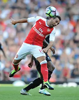 Arsenal's Cazorla Outmaneuvers Wijnaldum in Intense 2016-17 Arsenal vs. Liverpool Clash