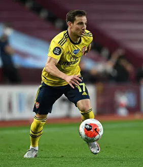 Images Dated 22nd July 2020: Arsenal's Cedric Faces Off in Intense Premier League Showdown Against Aston Villa