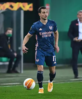 Arsenal's Cedric Faces Off Against Rapid Vienna in Europa League Clash