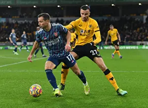 Arsenal's Cedric Goes Head-to-Head with Romain Saiss in Premier League Battle
