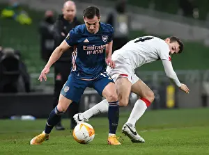 Dundalk V Arsenal 2020-21 Prints: Arsenal's Cedric Overpowers Dundalk's Wynne in Europa League Clash