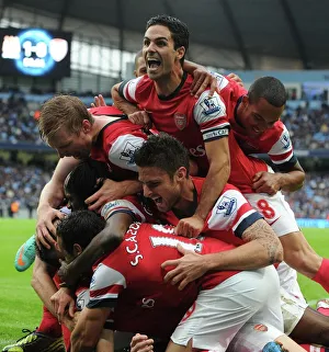 Arsenal's Celebration: Per Mertesacker, Gervinho, Santi Cazorla, Mikel Arteta, Theo Walcott, and Olivier Giroud