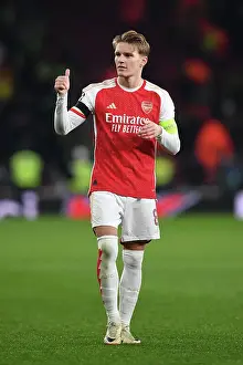 Arsenal V RC Lens 2023-24 Prints: Arsenal's Champions League Triumph: Martin Odegaard Reacts to Arsenal FC's Victory over RC Lens (2023-24)