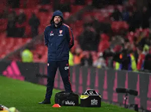 Arsenal's Chris Morgan Tends to Injured Player during Manchester United vs Arsenal (2019-20)