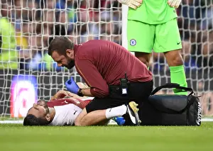 Arsenal's Chris Morgan Tends to Injured Sead Kolasinac during Arsenal v Chelsea Pre-Season Friendly (2018-19)