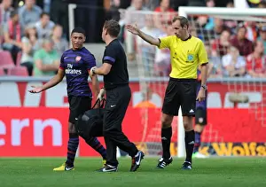 Cologne V Arsenal 2012-13 Prints: Arsenal's Colin Lewin Tends to Injured Oxlade-Chamberlain in Pre-Season Friendly against Cologne