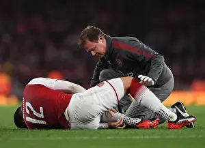 Arsenal's Colin Lewin Tends to Olivier Giroud during Match against Doncaster in Carabao Cup
