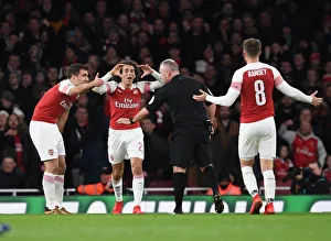 Arsenal's Contentious Carabao Cup Clash: Sokratis, Guendouzi, and Ramsey Protest Referee's Call against Tottenham