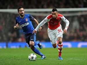 Images Dated 25th February 2015: Arsenal's Coquelin Clashes with Monaco's Moutinho in Champions League Showdown