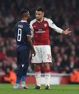 Arsenal V Red Star Belgrade 2017-18 Prints: Arsenal's Coquelin Engages with Red Star's Kanga during Europa League Clash