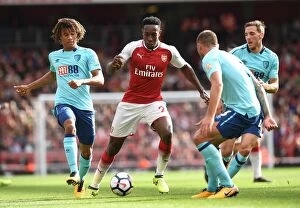 Arsenal v AFC Bournemouth 2017-18 Collection: Arsenal's Danny Welbeck Clashes with AFC Bournemouth's Nathan Ake