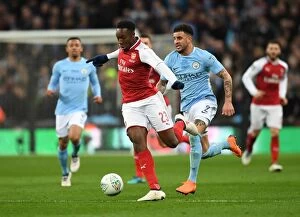 Images Dated 25th February 2018: Arsenal's Danny Welbeck Clashes with Manchester City's Kyle Walker in Carabao Cup Final Showdown