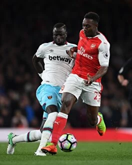 Images Dated 5th April 2017: Arsenal's Danny Welbeck Clashes with West Ham's Cheikhou Kouyate during the Premier League Match