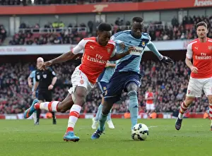 Arsenal V West Ham United 2014/15 Prints: Arsenal's Danny Welbeck Clashes with West Ham's Cheikhou Kouyate during the Premier League Match