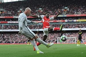 Images Dated 2nd April 2017: Arsenal's Danny Welbeck Closes In on Manchester City's Willy Caballero in Intense Premier League