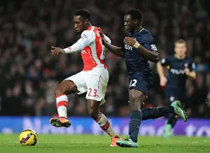 Arsenal V Southampton 2014-15 Prints: Arsenal's Danny Welbeck Fends Off Southampton's Victor Wanyama in Premier League Clash