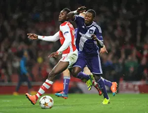 Arsenal V Anderlecht 2014/15 Prints: Arsenal's Danny Welbeck Fouled by Chancel Mbemba in UEFA Champions League Match against Anderlecht