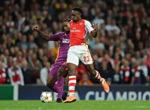 Arsenal V Galatasaray 2014/15 Champions League Prints: Arsenal's Danny Welbeck Scores Past Galatasaray's Aurelien Chedjou in 2014/15 Champions League Match