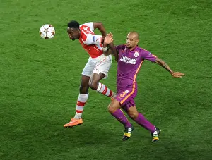Arsenal V Galatasaray 2014/15 Champions League Prints: Arsenal's Danny Welbeck vs. Felipe Melo: A Champions League Battle