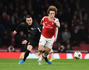 Arsenal's David Luiz Battles Past Eintracht Frankfurt's Filip Kostic in Europa League Clash