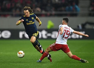 Images Dated 20th February 2020: Arsenal's David Luiz Clashes with Olympiacos Giorgos Masouras in Europa League Showdown