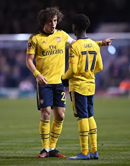 Arsenal's David Luiz Guides Bukayo Saka during FA Cup Clash vs Portsmouth