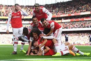 Arsenal V AFC Bournemouth 2019-20 Prints: Arsenal's David Luiz Scores and Celebrates with Team against AFC Bournemouth in 2019-20 Premier League