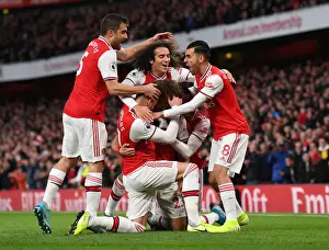 Arsenal V Crystal Palace 2019-20 Prints: Arsenal's David Luiz Scores and Celebrates with Team against Crystal Palace (2019-20)