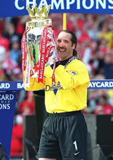 Arsenal's David Seaman Celebrates FA Premiership Title Win with the Trophy (Arsenal 4-3 Everton, 11/5/2002)