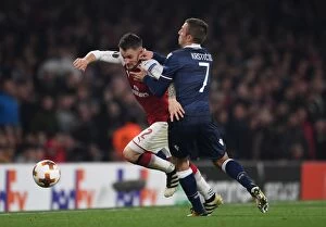 Arsenal v Red Star Belgrade 2017-18 Collection: Arsenal's Debuchy Clashes with Red Star's Krsticic in Europa League Showdown