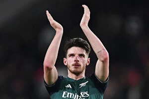 Images Dated 12th December 2023: Arsenal's Declan Rice Celebrates UEFA Champions League Victory with Fans at PSV Eindhoven