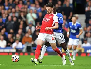 Arsenal's Declan Rice Fights Past Everton's Abdoulaye Doucoure in Premier League Clash (Everton vs Arsenal 2023-24)
