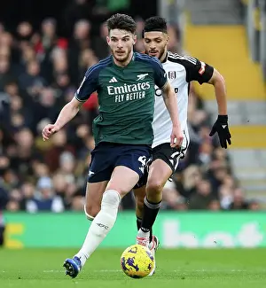 Arsenal's Declan Rice Fights Past Fulham's Raul Jimenez in Premier League Clash (Fulham v Arsenal 2023-24)