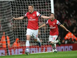 Arsenal V Wigan Athletic 2012-13 Prints: Arsenal's Dominance: Podolski's Brace - Arsenal Crushes Wigan Athletic 4-1 in Premier League (2012-13)