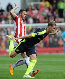 Images Dated 13th May 2017: Arsenal's Dominance: Rob Holding Scores Against Marko Arnautovic as Arsenal Thrash Stoke 4-1 in