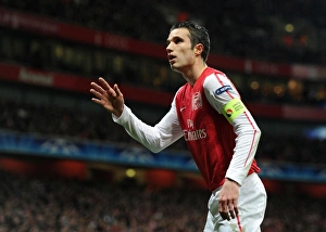 Arsenal's Dominant Display: Robin van Persie Scores Three as Arsenal Crush AC Milan 3-0 in UEFA Champions League