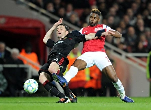 Arsenal's Dominant Performance: 3-0 Over AC Milan in Champions League Round of 16 (Alex Song vs Mark van Bommel)