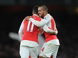 Arsenal v Manchester City 2015-16 Collection: Arsenal's Double Celebration: Walcott and Ozil's Goal Connection Against Manchester City (2015-16)
