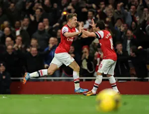 Arsenal V Liverpool 2013-14 Prints: Arsenal's Double Delight: Ramsey and Cazorla's Unforgettable Goal Celebration (2013-14)