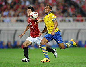 Uwara Red Diamonds V Arsenal 2013-14 Prints: Arsenal's East Asian Battle: Theo Walcott vs. Kunimitsu Sekiguchi (2013)