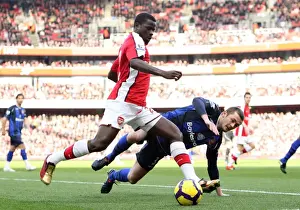 Arsenal's Eboue and McCartney Clash in Arsenal's 2-0 Victory over Sunderland in the Premier League, 20/2/10