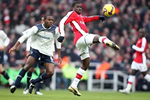 Arsenal V Bolton Wanderers 2008-09 Prints: Arsenal's Eboue and Muamba Clash in Intense Rivalry: Arsenal 1:0 Bolton
