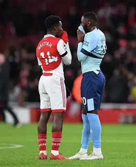 Arsenal's Eddie Nketiah and Brentford's Josh Dasilva Share a Moment After Arsenal FC vs Brentford FC in Premier League
