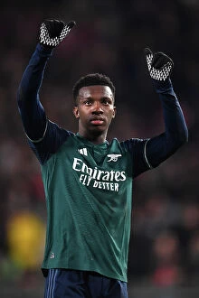 Images Dated 12th December 2023: Arsenal's Eddie Nketiah Celebrates with Fans after PSV Victory in Champions League Group Stage