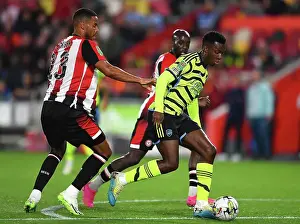 Brentford V Arsenal - Carabao Cup 2023-24 Prints: Arsenal's Eddie Nketiah Chases Ball in Carabao Cup Clash vs. Brentford