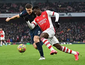 Arsenal's Eddie Nketiah Clashes with Burnley's James Tarkowski in Premier League Showdown
